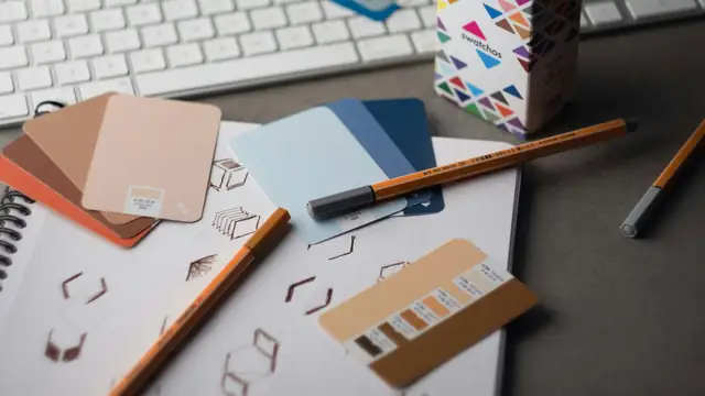 Desk with colour samples and pencils