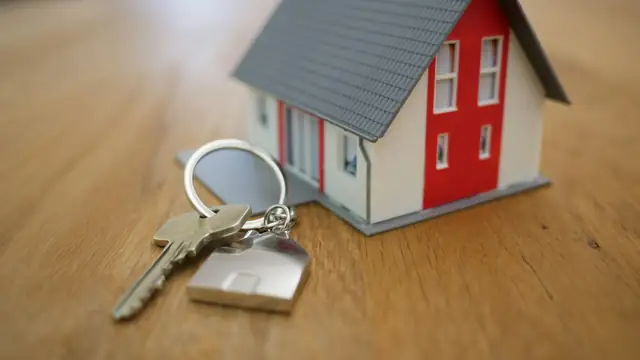 Small model house on a wooden table