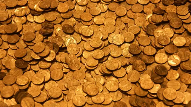Coins on a wooden surface
